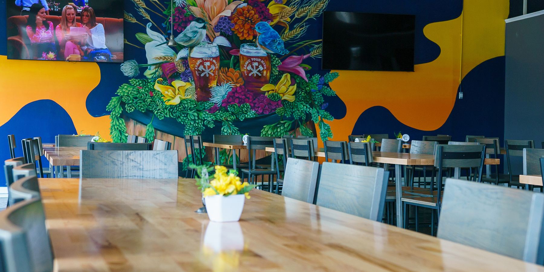 The Richmond dining room under a large floral mural